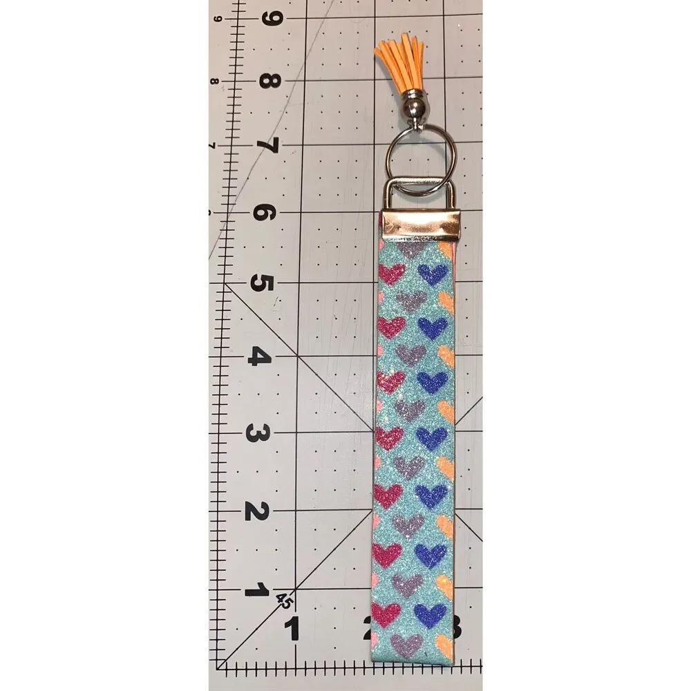 ☀️3/$9☀️ Glitter Heart Faux Leather Keychain with Orange Tassel